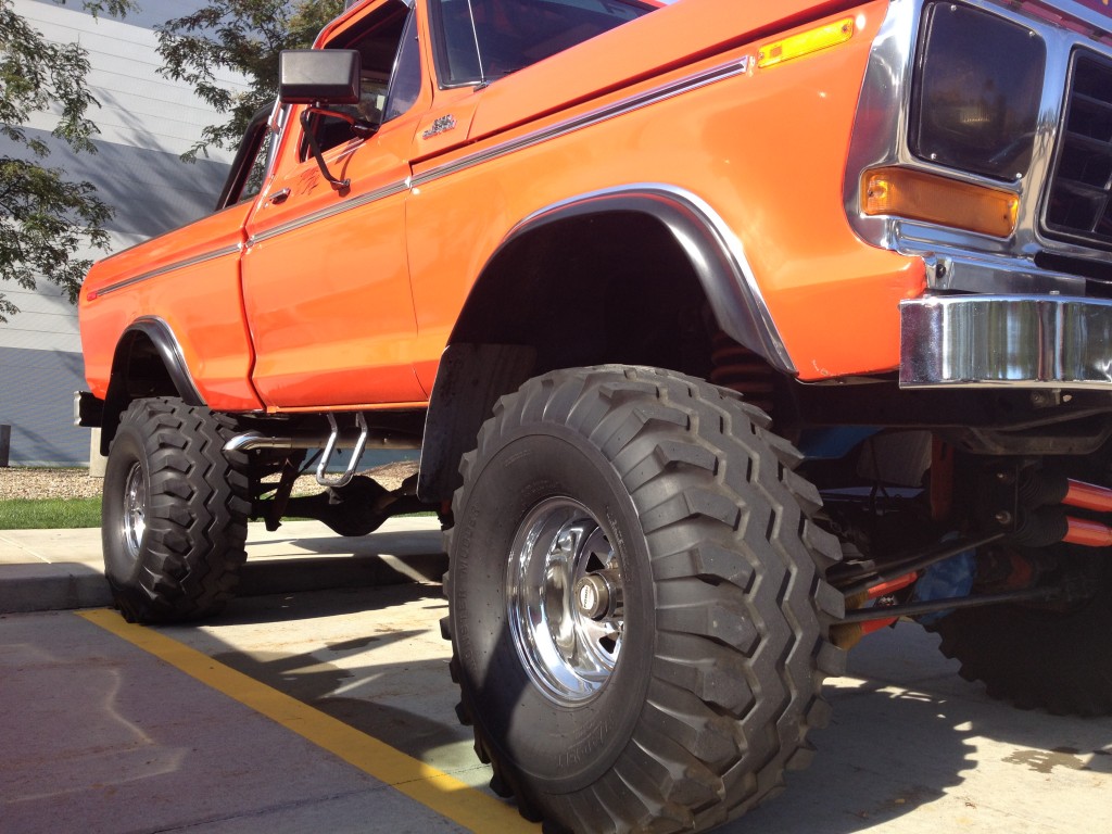 close up of off road tires on a vintage lifted truck