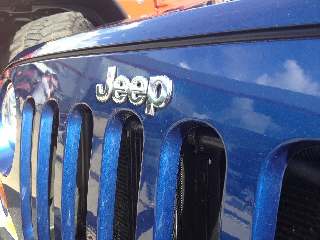 close up of jeep emblem on grille of a wrangler jk