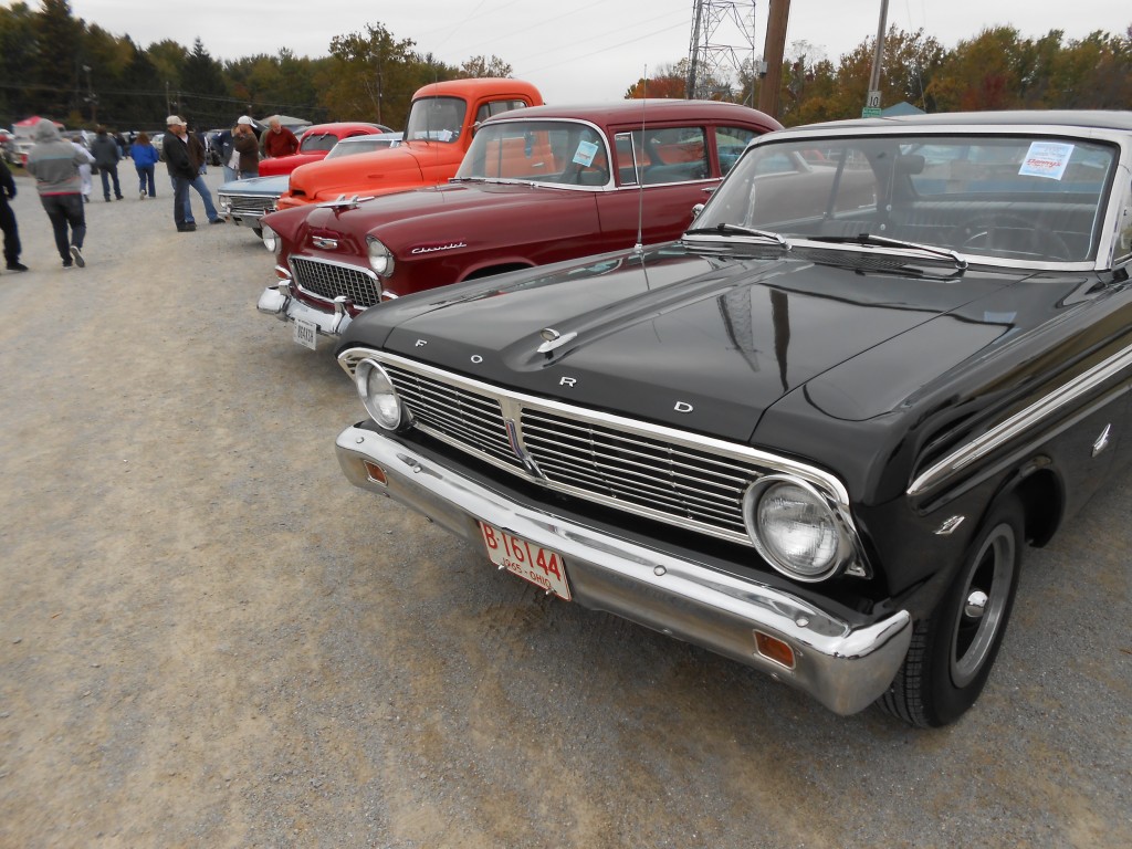 row of classic cars at a show