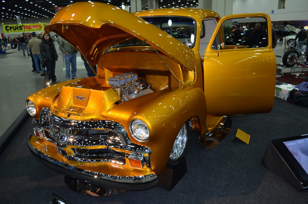 gold chevy 3100 truck at indoor car show