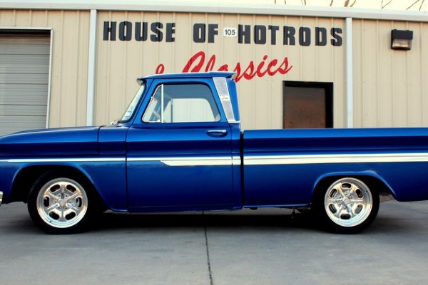 side view of a blue vintage truck