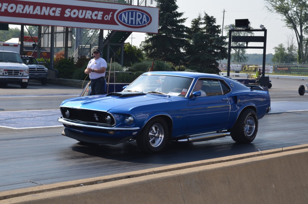 vintage day 2 ford mustang with custom wheels and side pipes