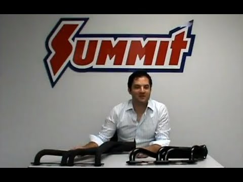 man behind table with engine headers