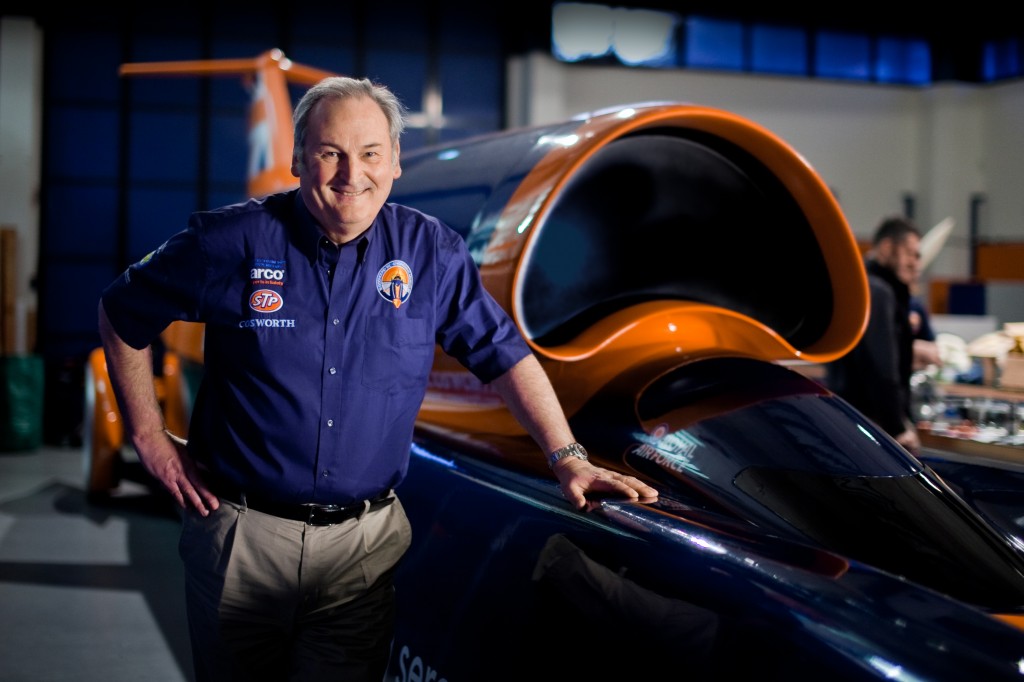 man poses with bloodhound super sonic car