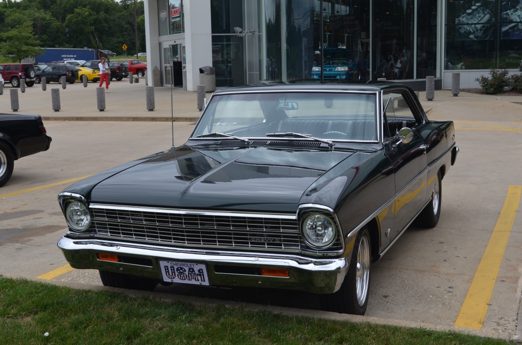 front grille view of a black 1967 Chevy II Nova with custom wheels