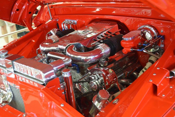chromed out engine in a vintage hot rod truck