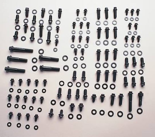 an assortment of engine hardware sorted on a table