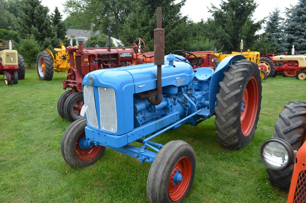 vintage blue farm tractor at an antique farm equipment show