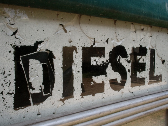 worn and weathered diesel fuel sign