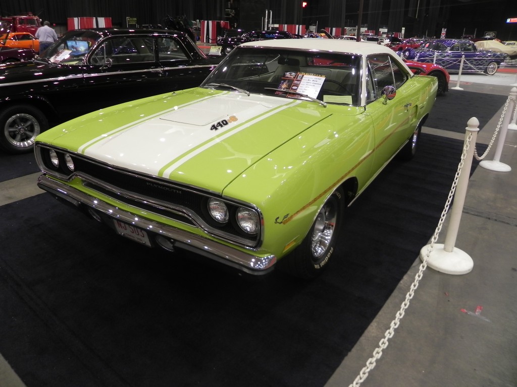 plymouth roadrunner 440 on display at indoor car show