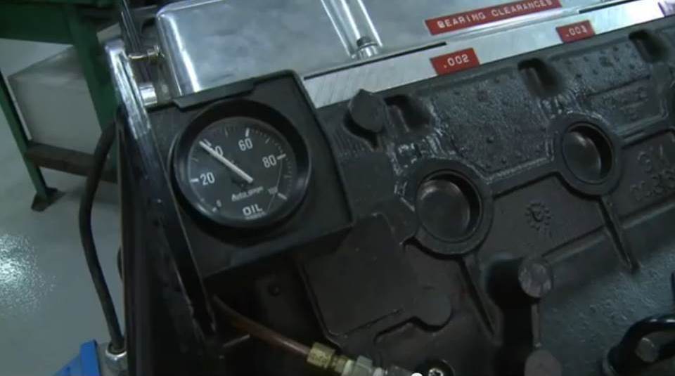 oil pressure gauge near an engine block