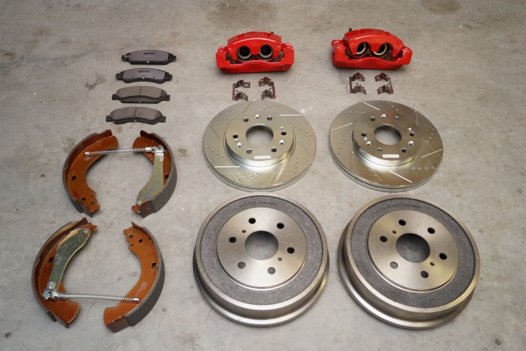 disc and drum Brake Kit components on a garage floor