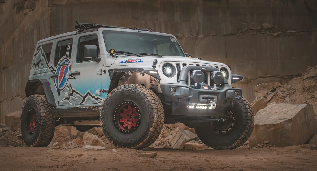 jeep wrangler at dusk in a rock quarry