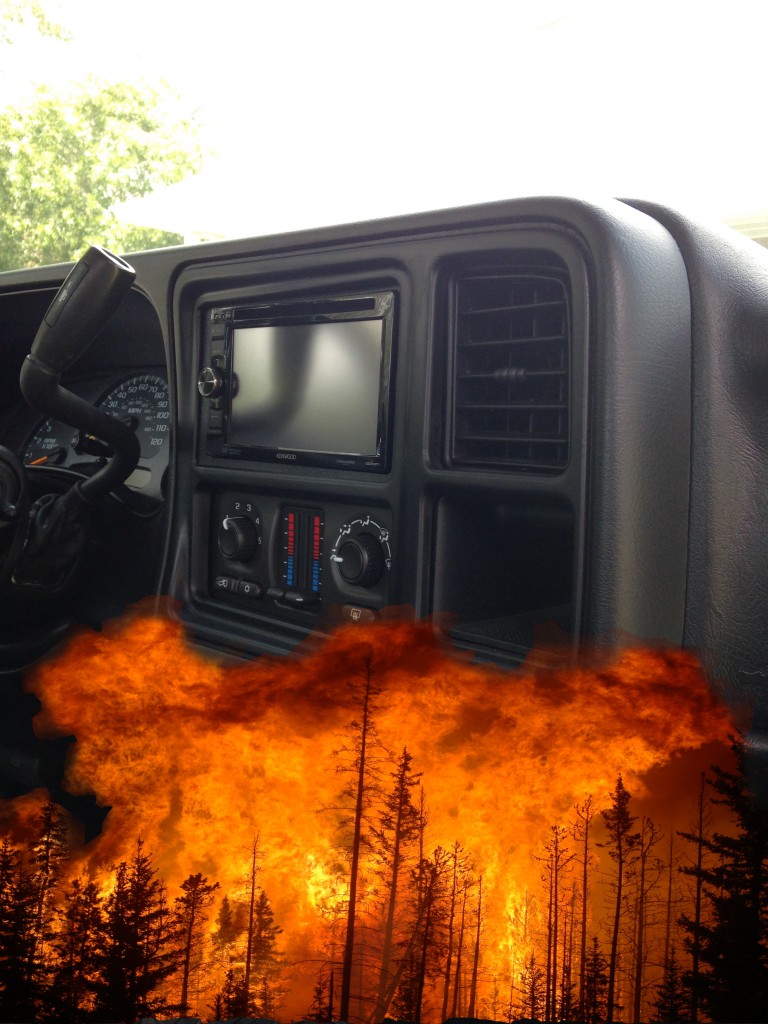 A Silverado truck dash with a cropped image of a fire