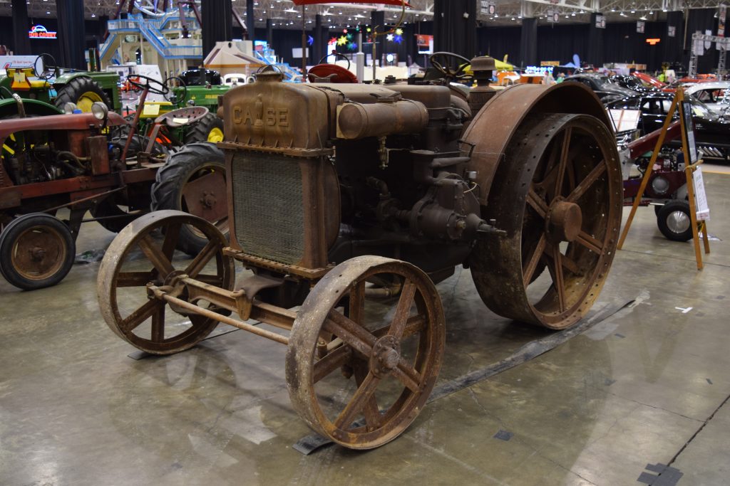 antique case farm tractor displayed at a classic car show