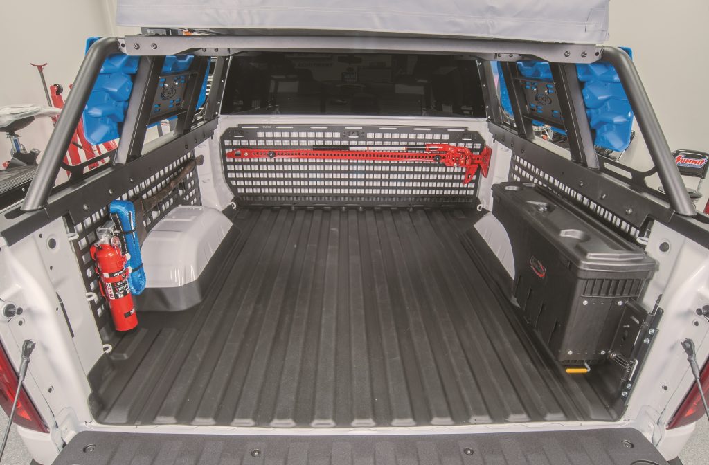 inside of a truck bed outfitted with cargo racks