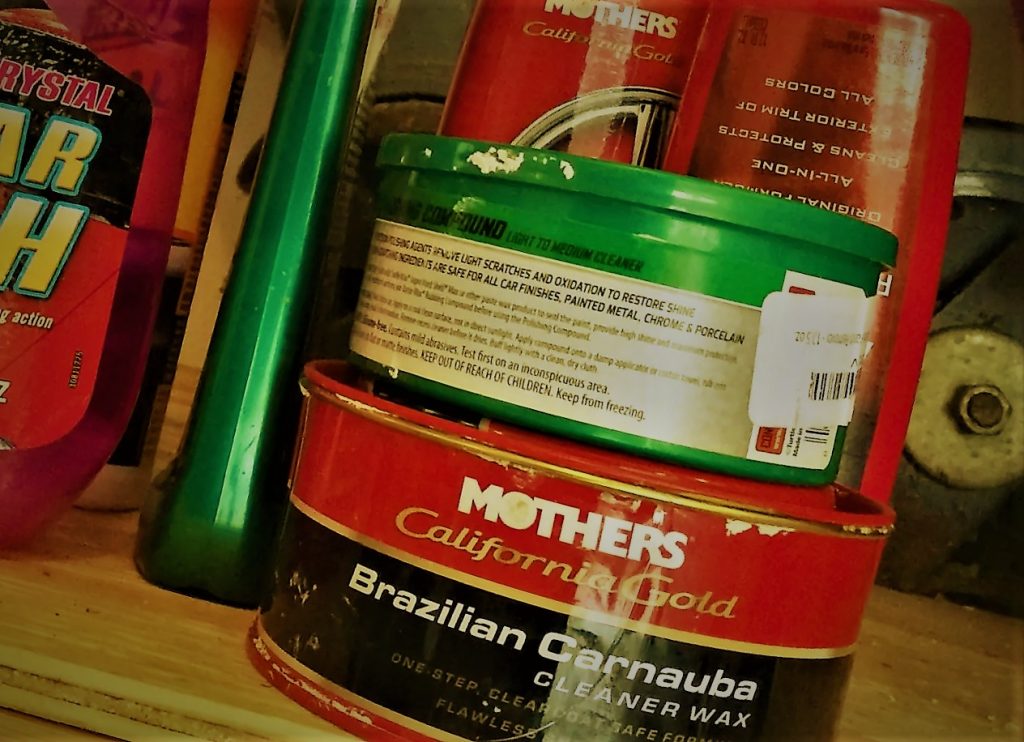 stylized photo of car wax canisters on a shelf