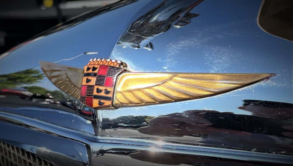 Close up of vintage cadillac winged crest emblem