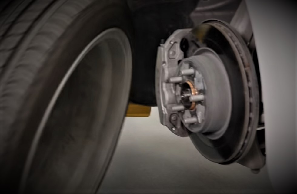 disc brake caliper and rotor on a tesla model 3