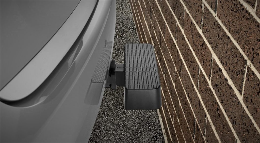 WeatherTech BumpStep protecting an SUV ata brick wall