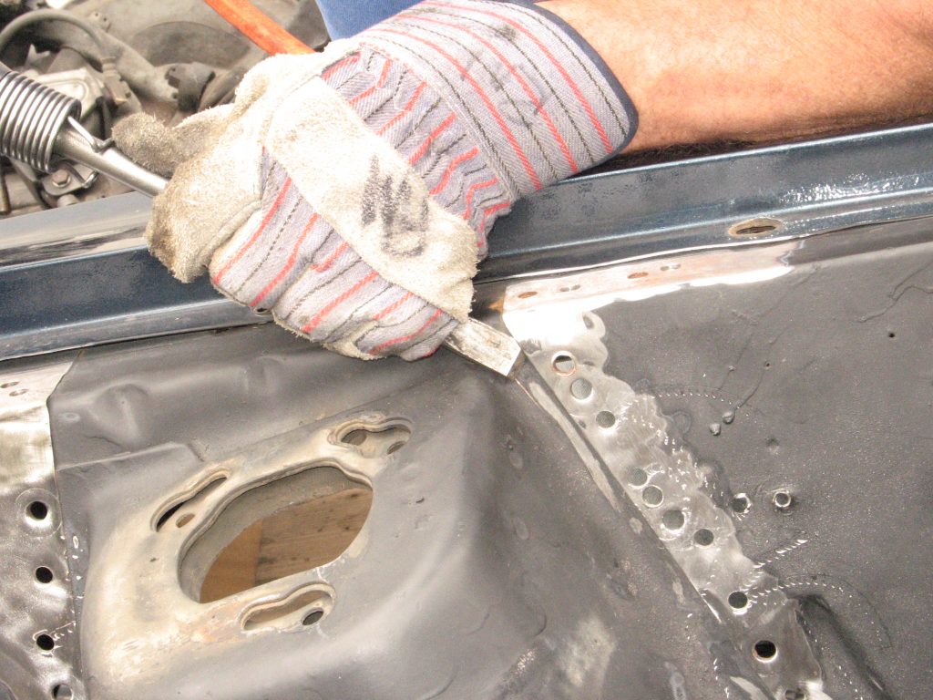 using air chisel on a ford mustang fender shock tower