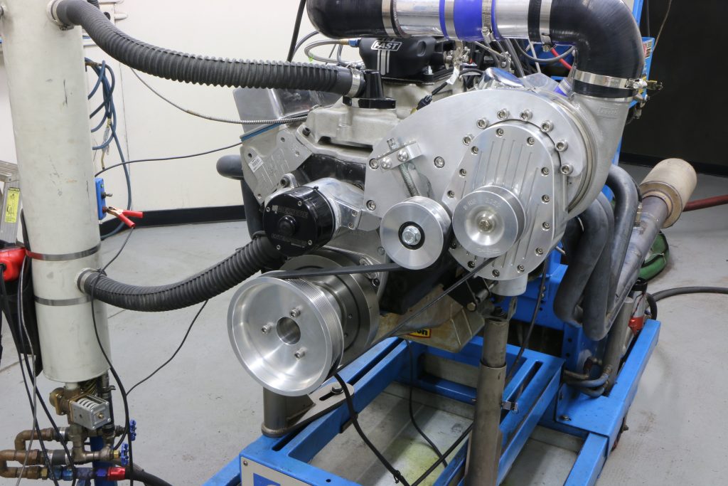 front view of a supercharged engine on a dyno