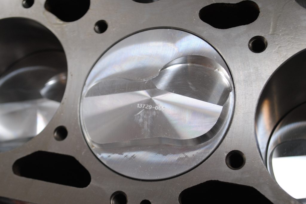 dish valve relief in a piston head