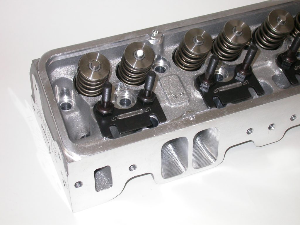engine cylinder head on table with rockers removed