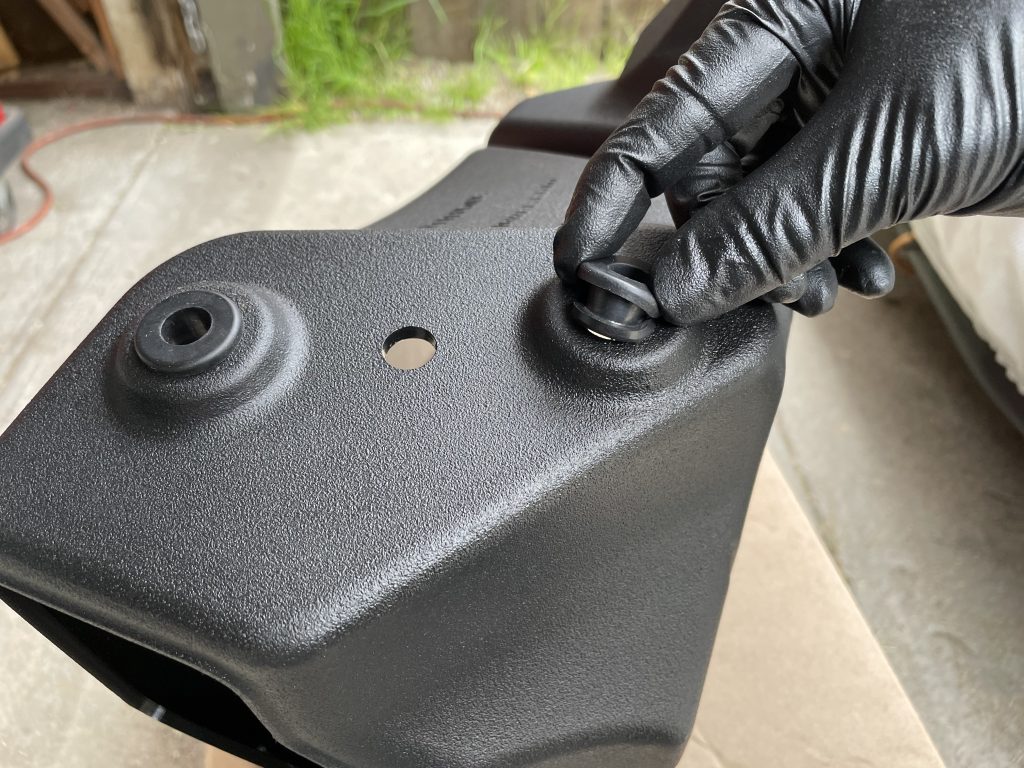 inserting a grommet into an air intake box