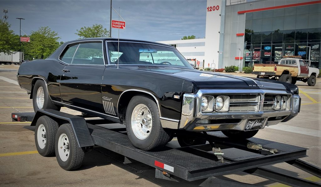 front passenger side view of a 1969 buick wildcat on a trailer