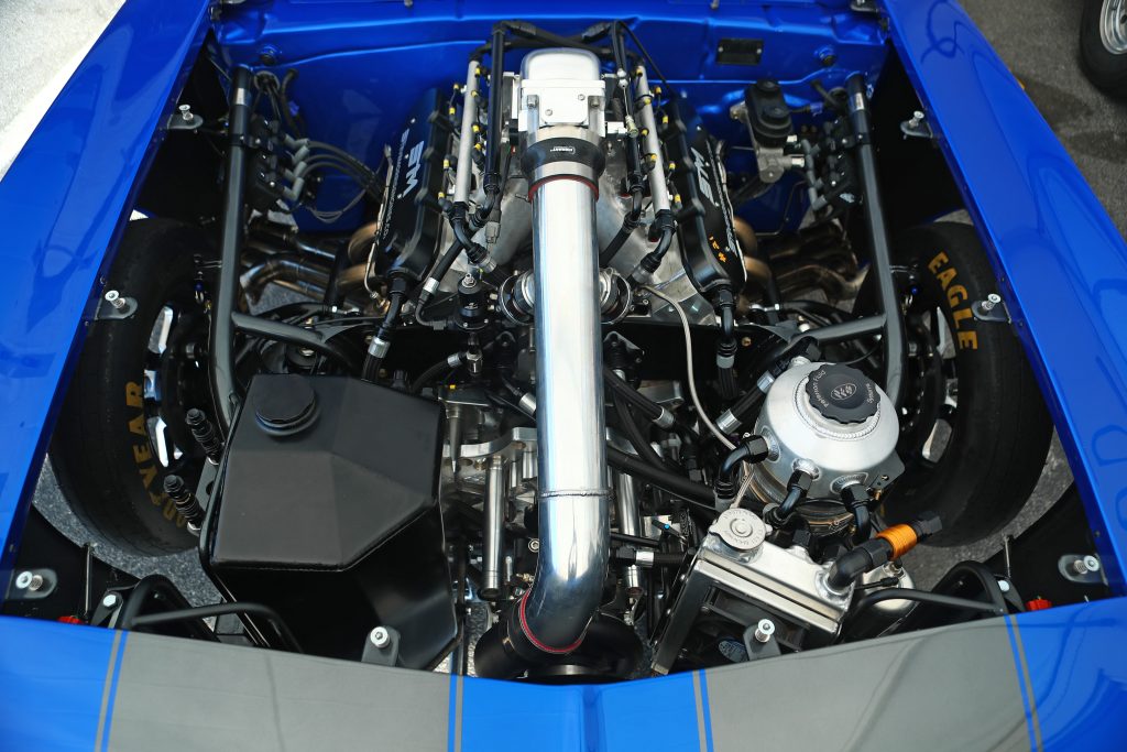 supercharged v8 engine in a sportsman camaro dragster