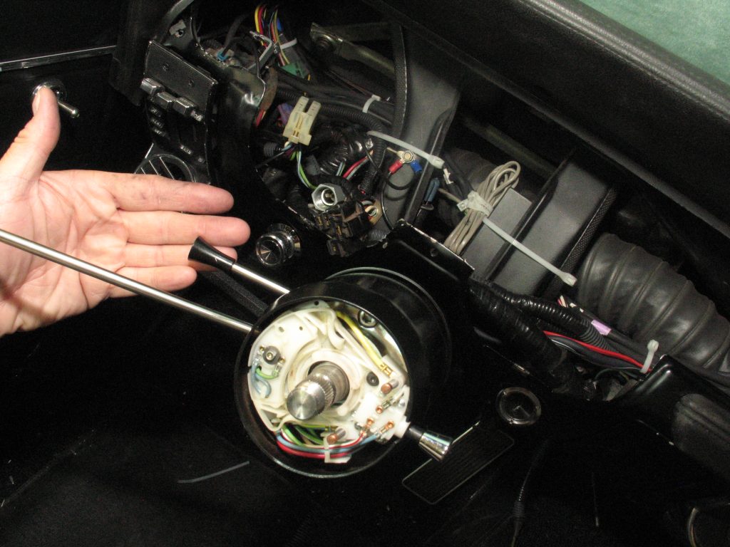 Steering column tilt adjuster and turn signal levers