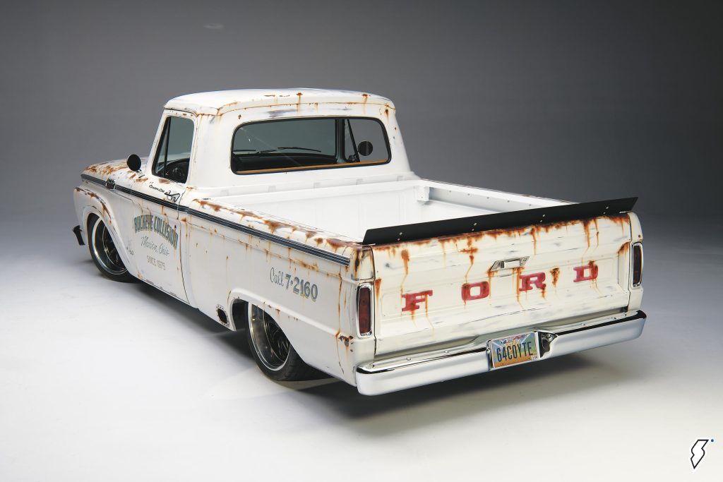 white 1964 Ford F100 pickup truck restomod, rear driver side