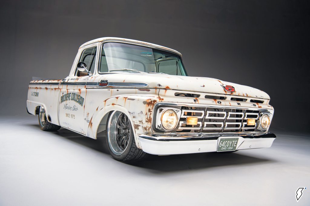 white 1964 Ford F100 pickup truck restomod, low quarter shot