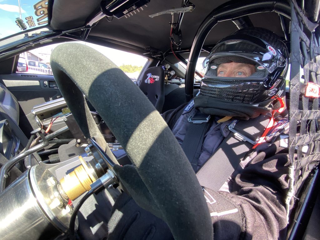 racer in cockpit during drag race