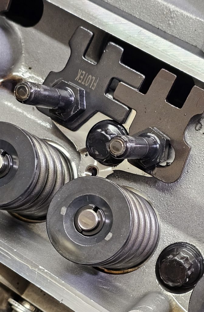 rocker arm mount studs on a cylinder head with springs