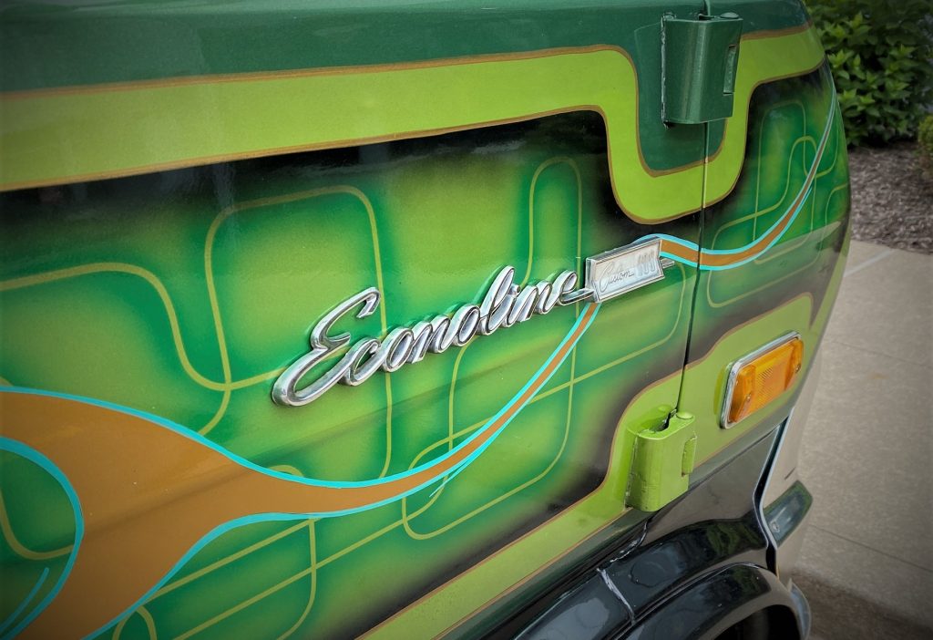 fender badge on a green custom 1974 Ford Econoline van