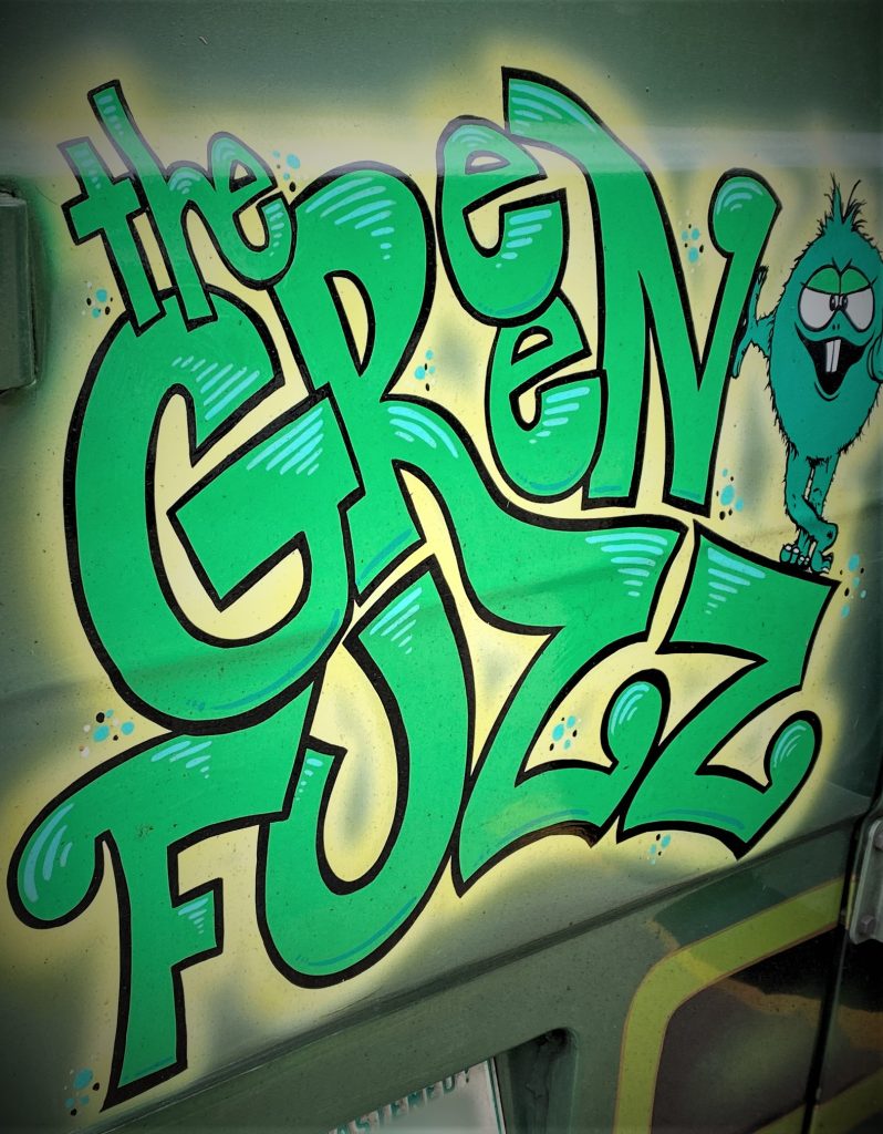 green fuzz custom paint on the back of a van