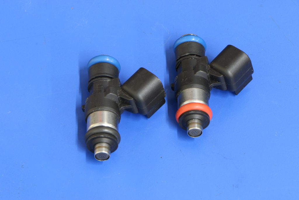 a pair of fuel injectors on a table