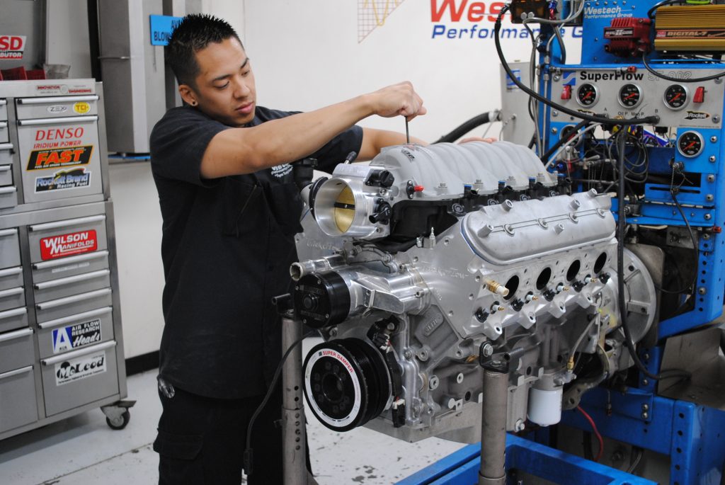 man preparing a ls engine for dyno test run