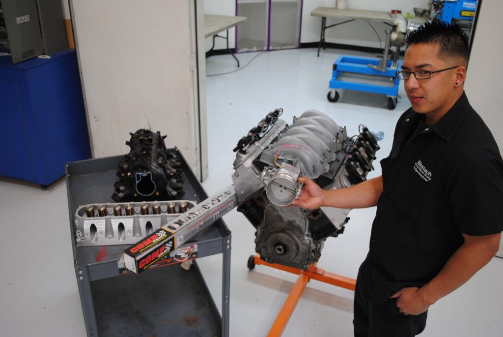 Man standing near ls engine on rolling stand