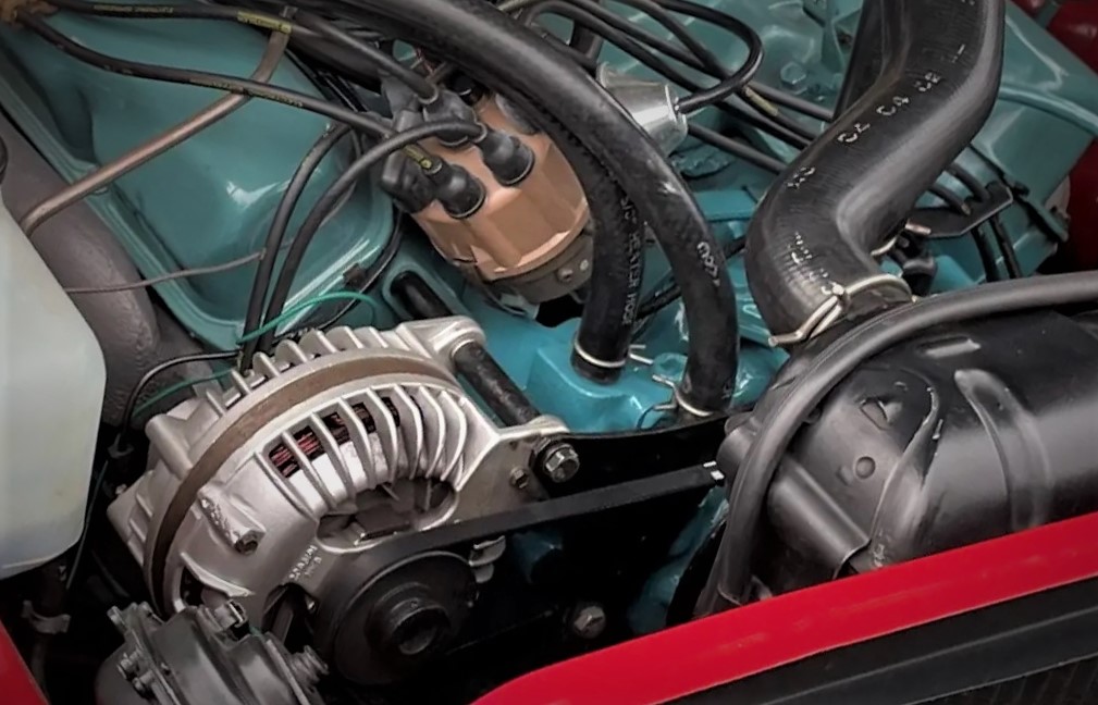 close up of alternator on a vintage 383 mopar engine in a 1966 charger