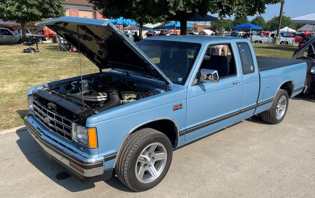 blue chevy s10 truck with hood open