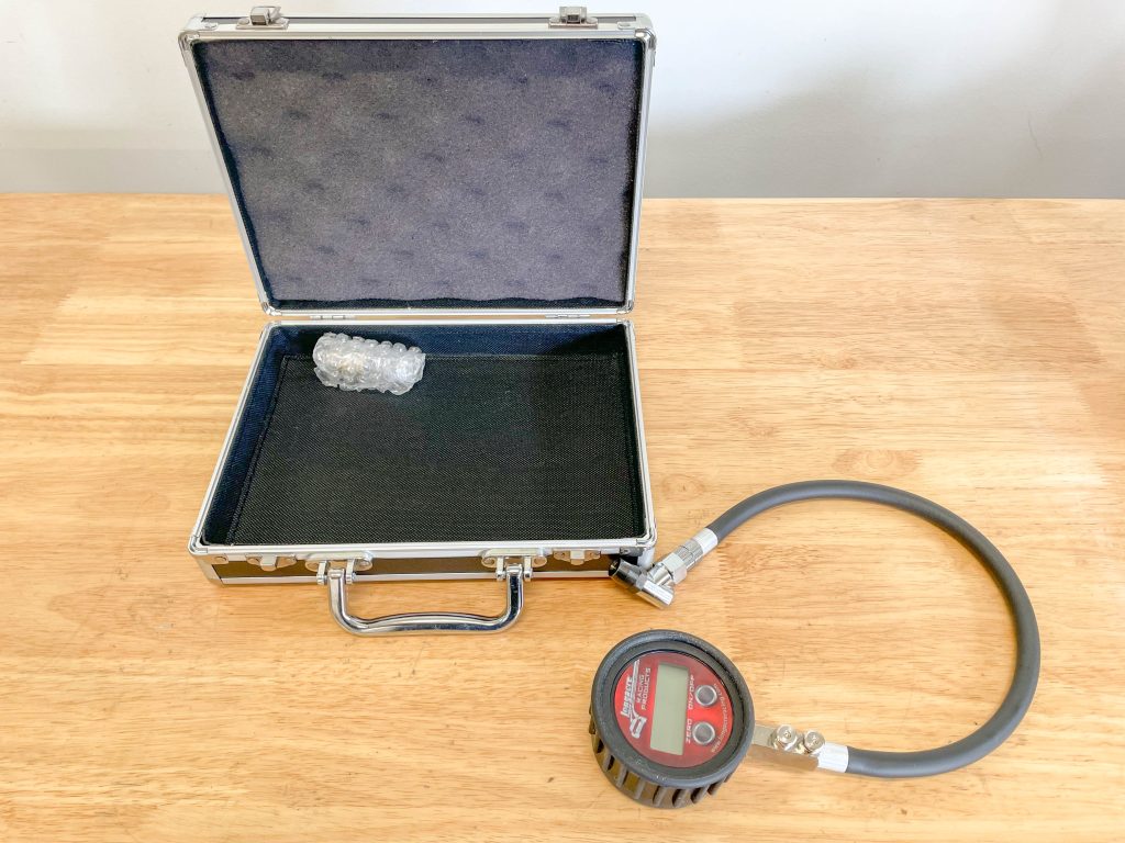 Tire pressure gauge with case