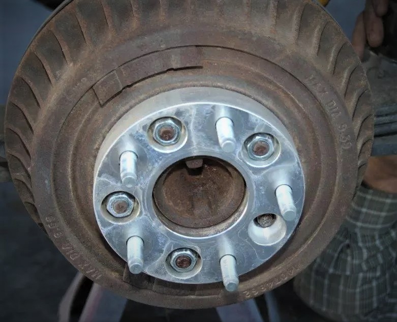 wheel lug adapter mounted on a drum brake