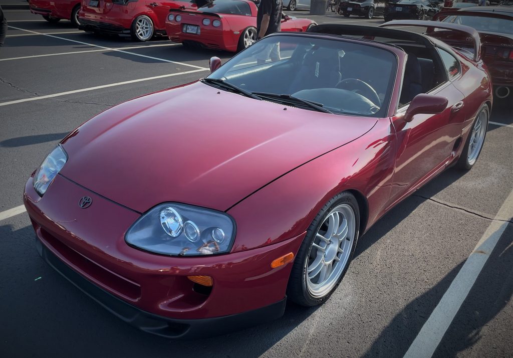 Red Toyota Supra MK. IV with custom wheels