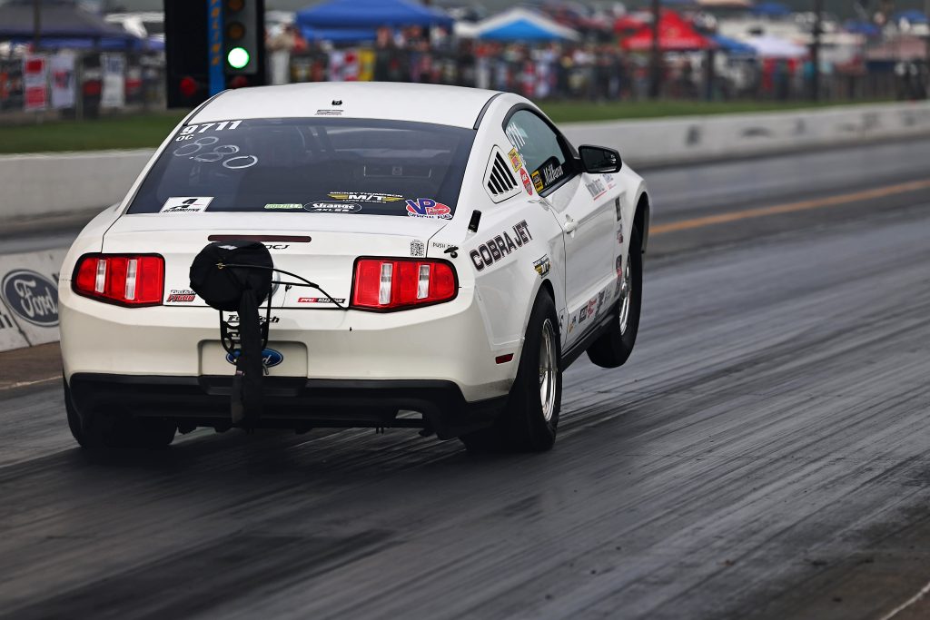 cobra jet ford mustang doing wheelstand at track