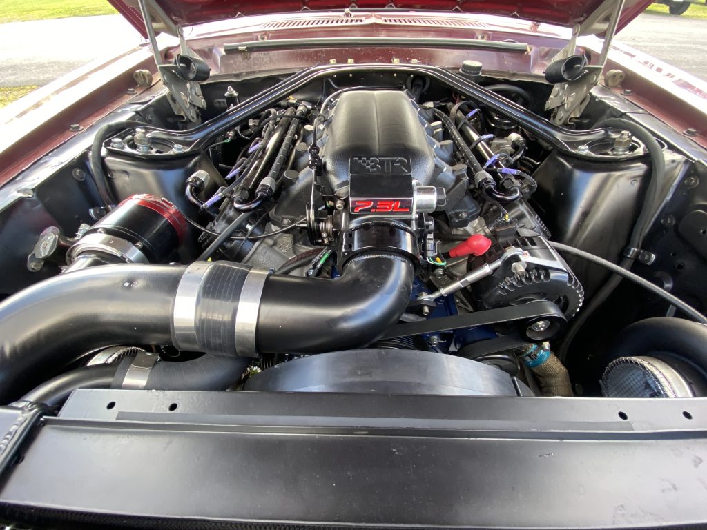 Ford 7.3L Godzilla engine in a vintage car