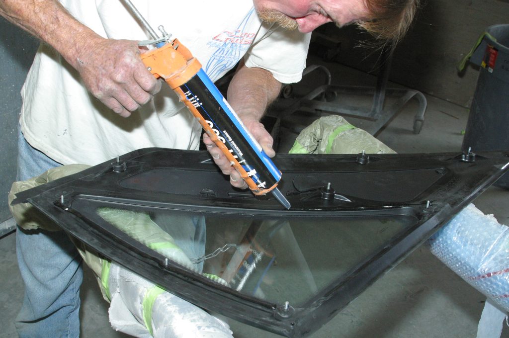 Applying sealer to Mustang rear quarter window