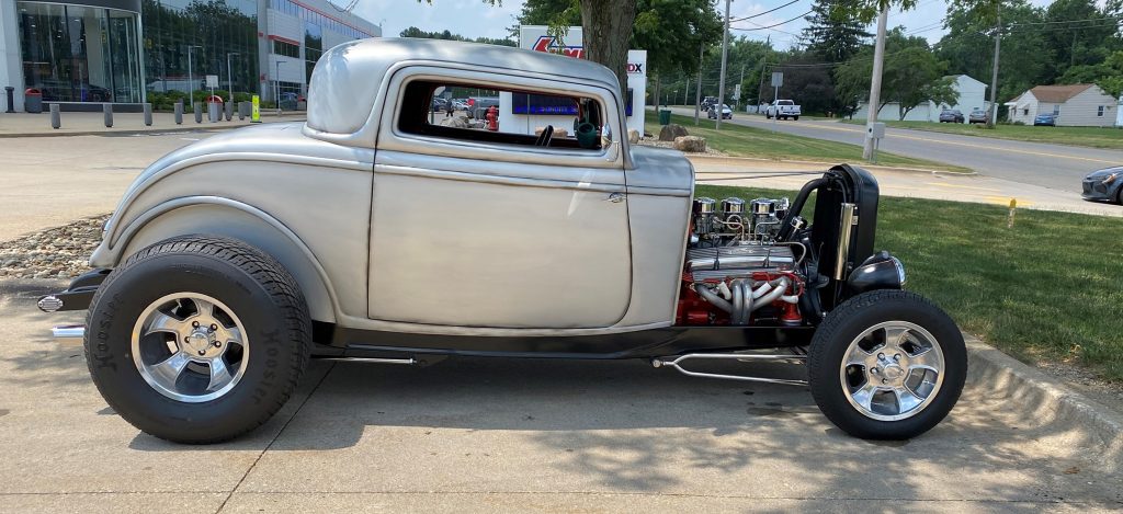 side profile view of a 1932 ford highboy 3-window hotrod coupe